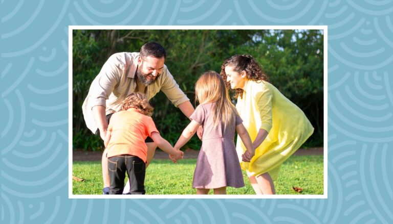 Family playing outdoor games together during fun weekend family activity.