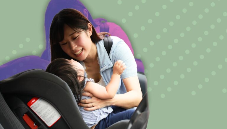 Mother breastfeeding baby in an airplane seat.