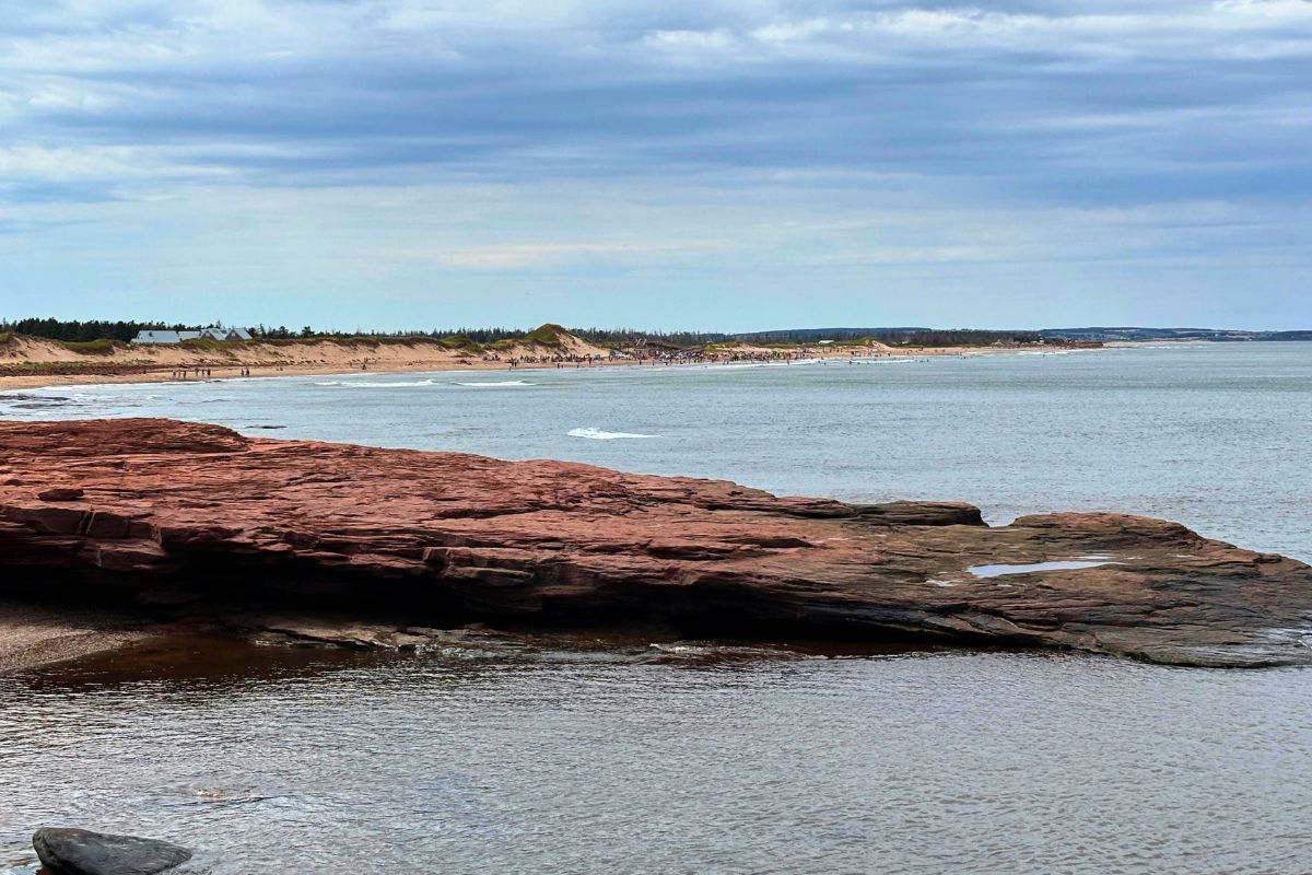 Red cliffs and quiet beach shoreline in Prince Edward Island, Canada.