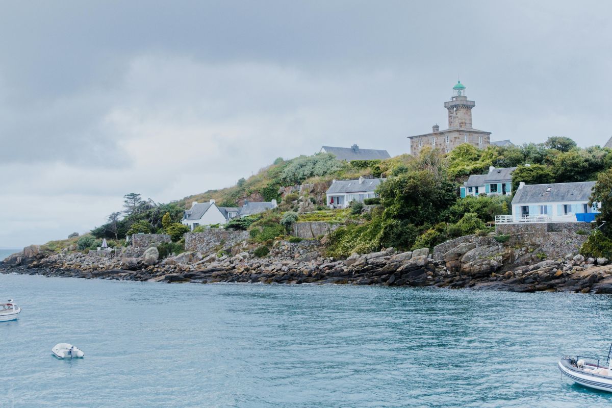 Coastal village and lighthouse view during family trip in Canada.