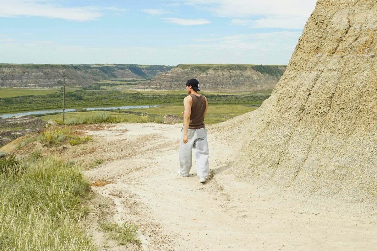 Person hiking through Drumheller Badlands in Alberta, Canada.