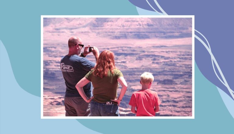 Family overlooking scenic canyon during affordable family vacation in Canada.