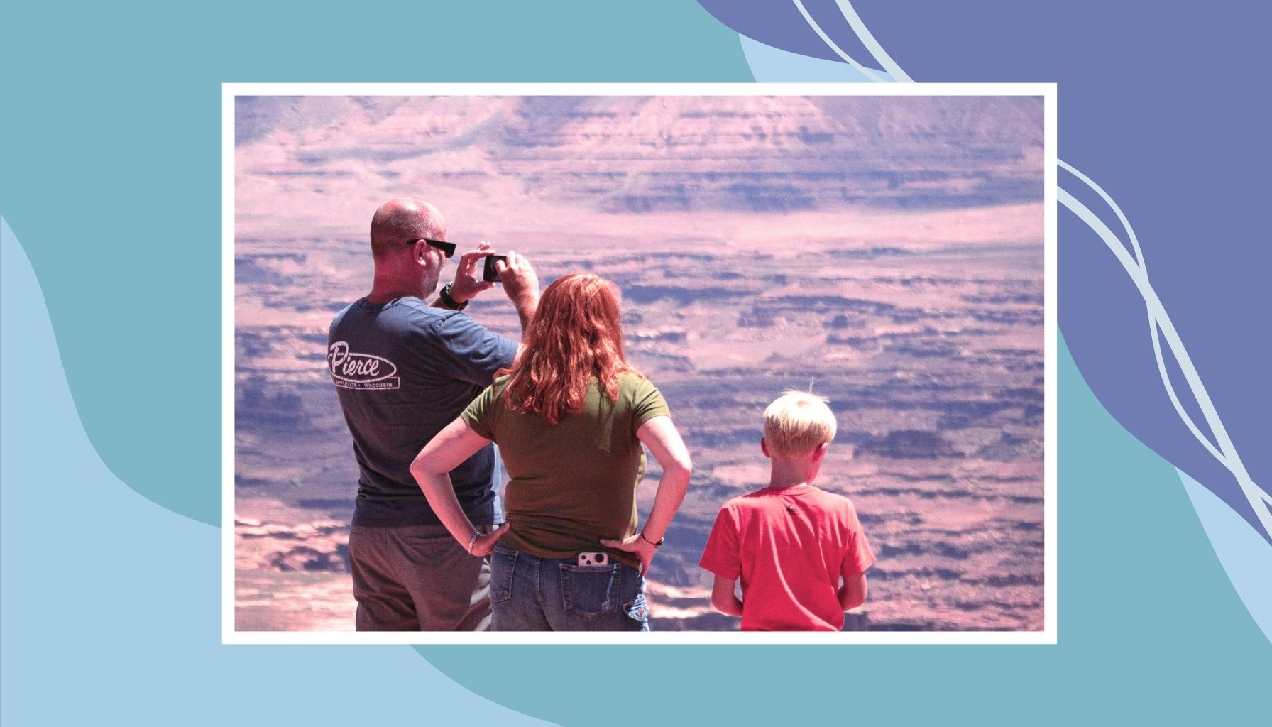 Family overlooking scenic canyon during affordable family vacation in Canada.
