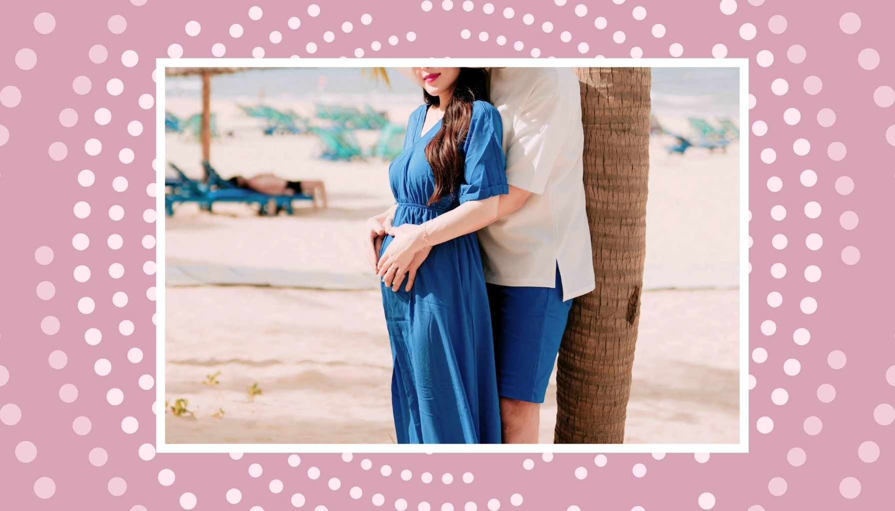 Pregnant couple posing by the beach for a relaxing all-inclusive babymoon trip before welcoming their baby.