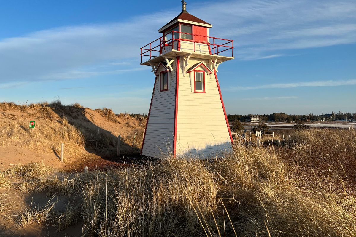 Coastal lighthouse view in Prince Edward Island during a relaxing Canadian babymoon.