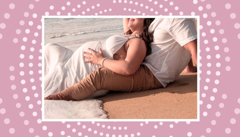Pregnant couple relaxing on a beach during a romantic babymoon getaway in Canada.