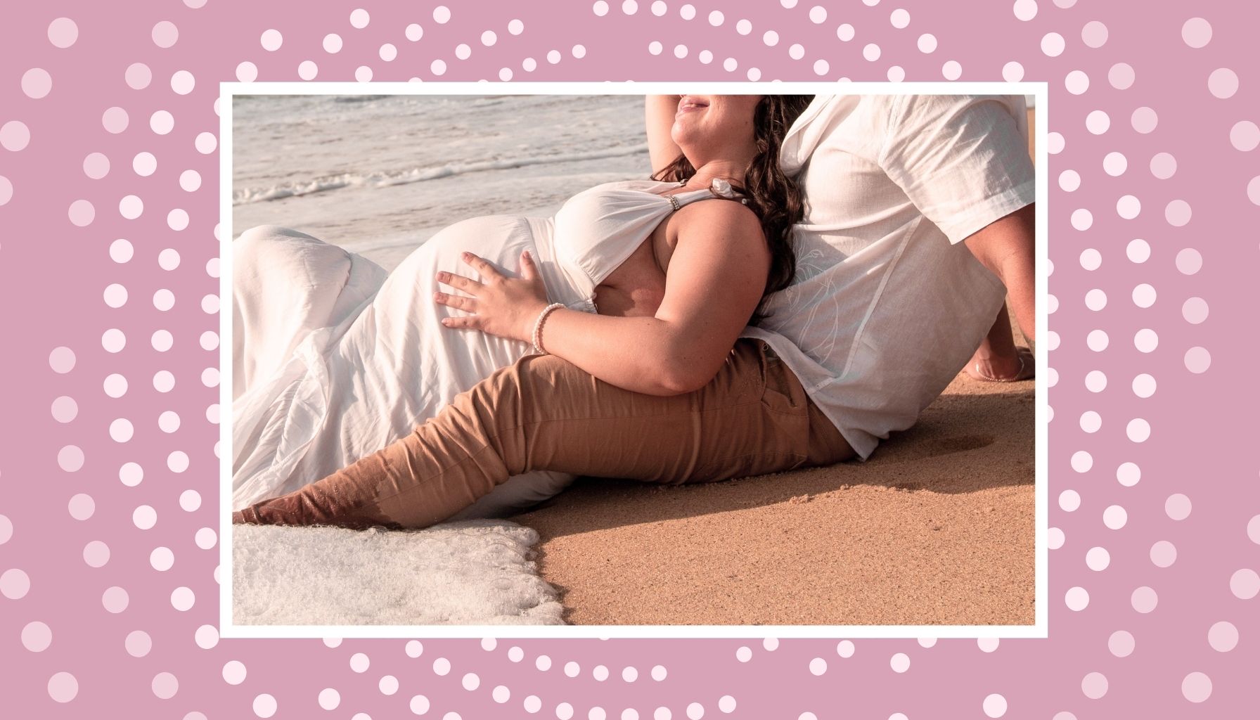 Pregnant couple relaxing on a beach during a romantic babymoon getaway in Canada.