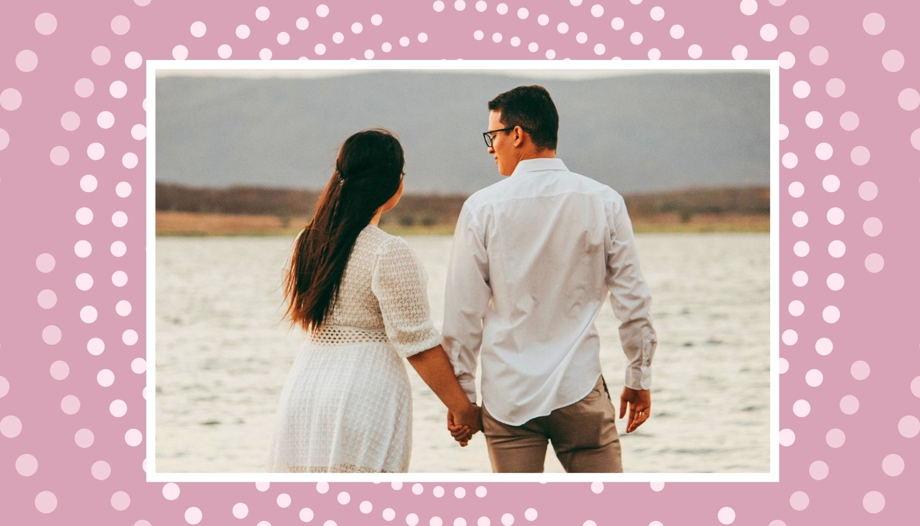 Expecting couple walking by the water for a calm babymoon before baby arrives.