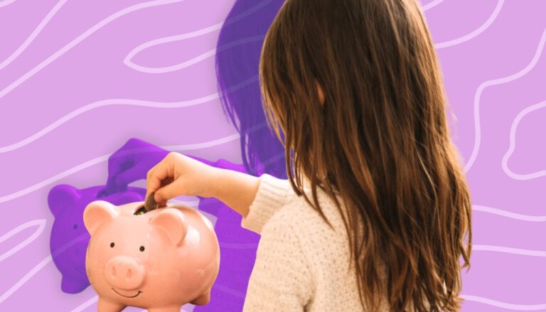 Kid putting money in piggy bank as part of early budgeting habits.