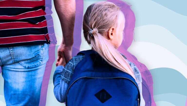 Parent holding a child’s hand on the way to daycare.