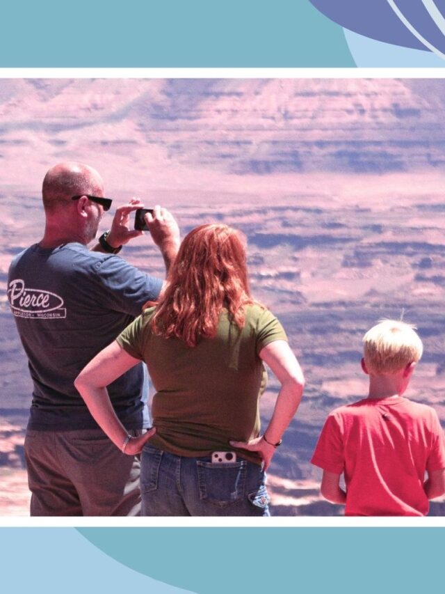 Family overlooking scenic canyon during affordable family vacation in Canada.
