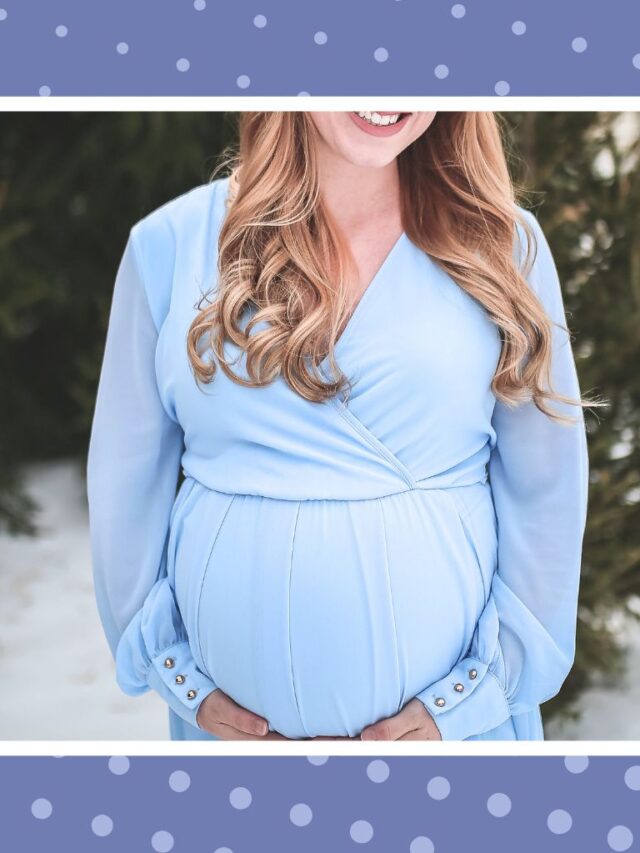 Pregnant woman in a blue dress posing outdoors, representing natural ways to reduce stress during pregnancy.