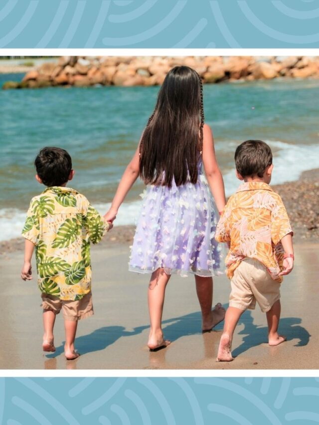 Kids walking together on the beach during a fun summer family staycation.