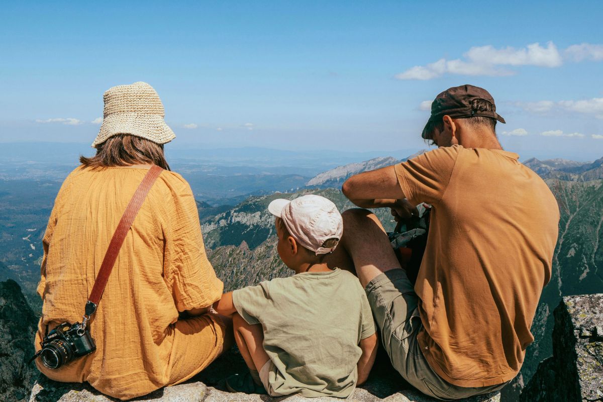 Family enjoying scenic mountain views during a Canada vacation, showcasing outdoor adventures and family travel experiences.