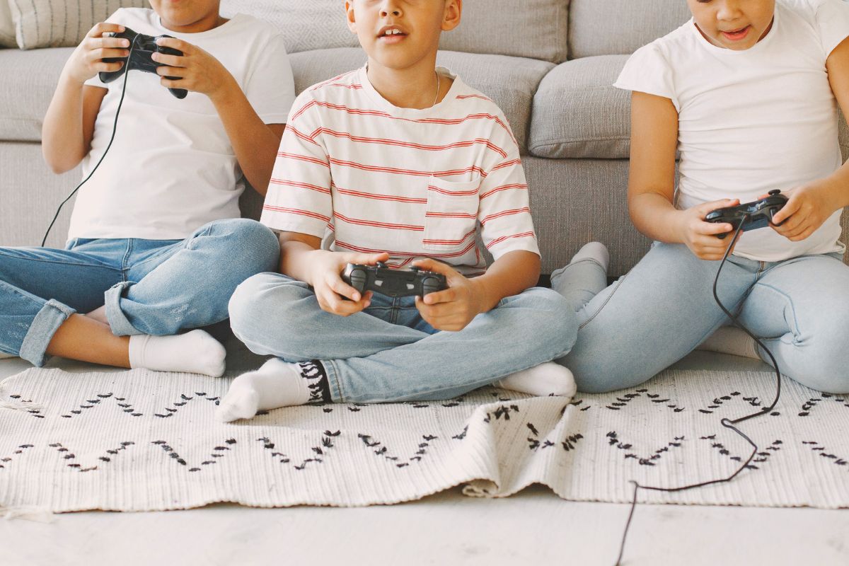 Children playing video games as part of balanced kids screen time.