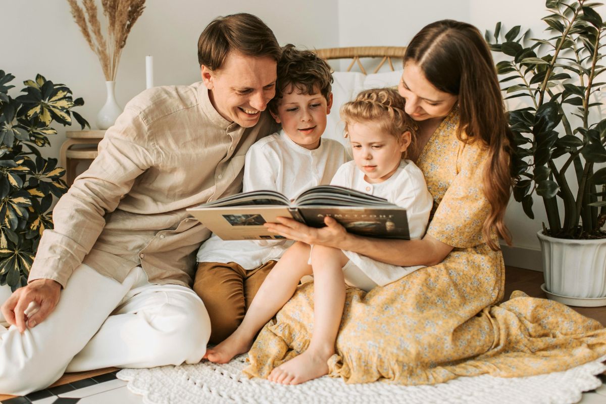 Family enjoying screen free reading time together at home.
