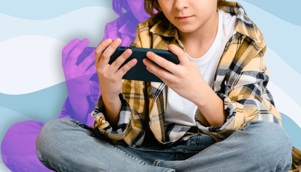 Child using a smartphone to illustrate healthy kids screen time habits at home.