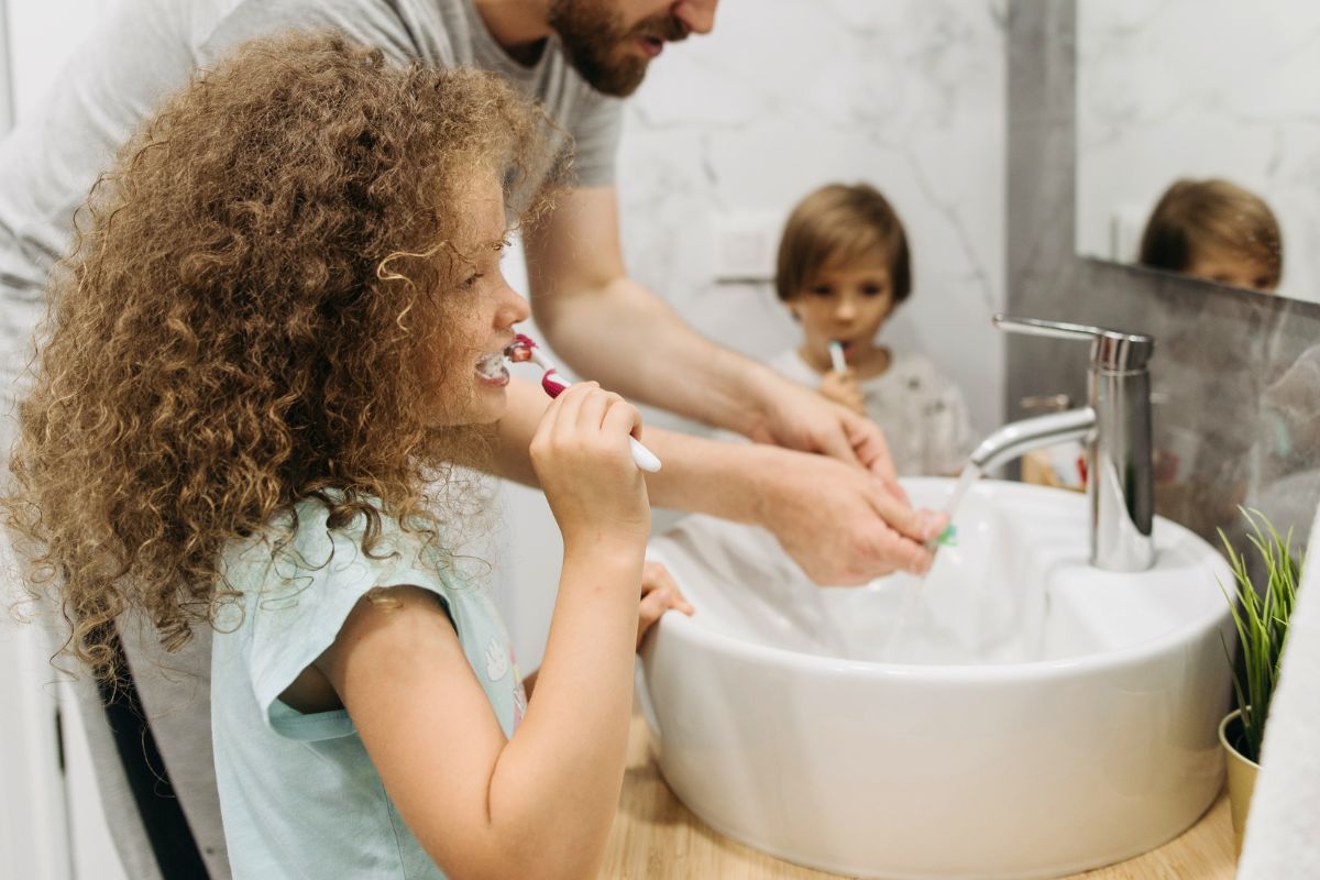 Children brushing their teeth as part of a simple daily routine.