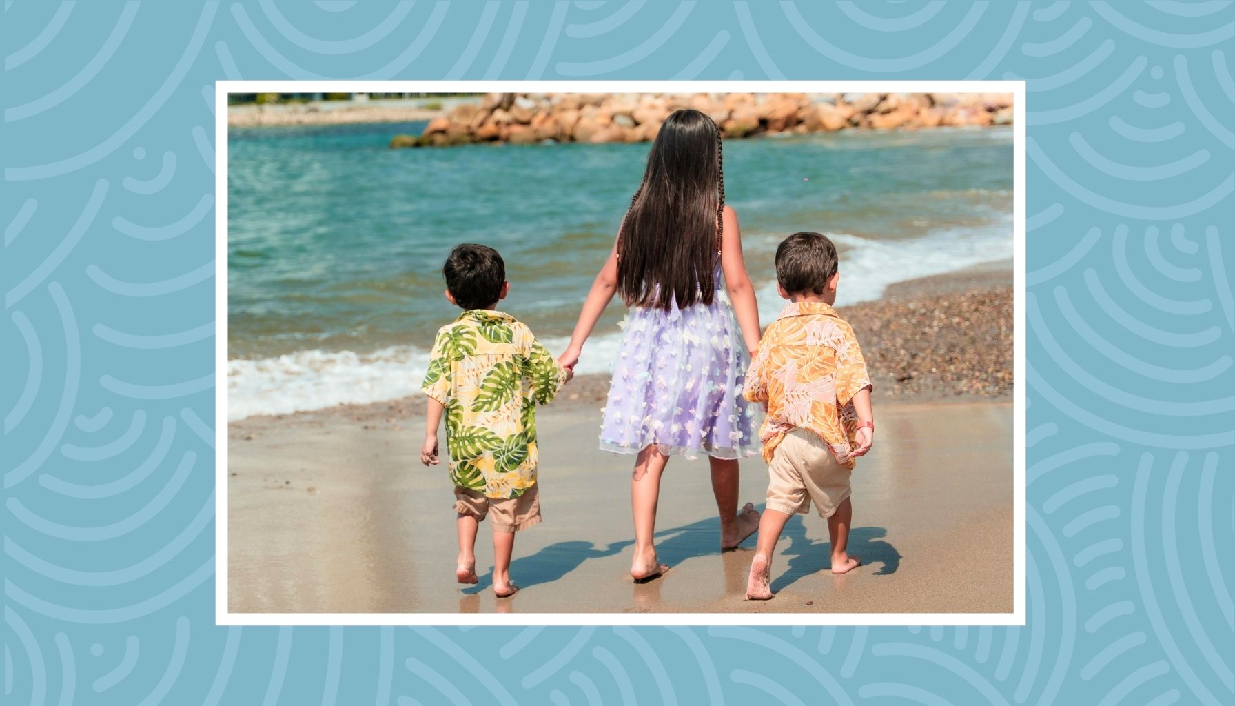 Kids walking together on the beach during a fun summer family staycation.