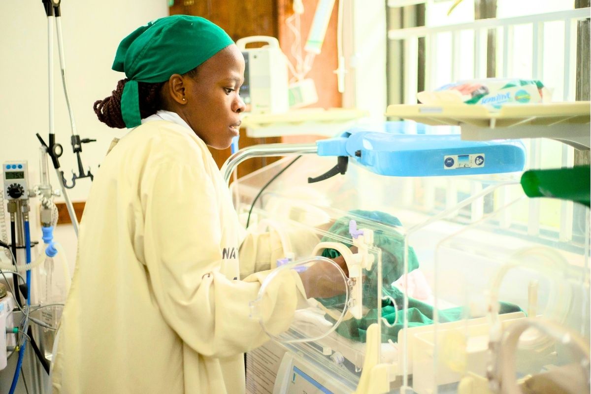 Nurse attending to a newborn baby.