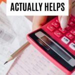 Budget planning setup with calculator, receipts, and paperwork for tracking spending and saving money.