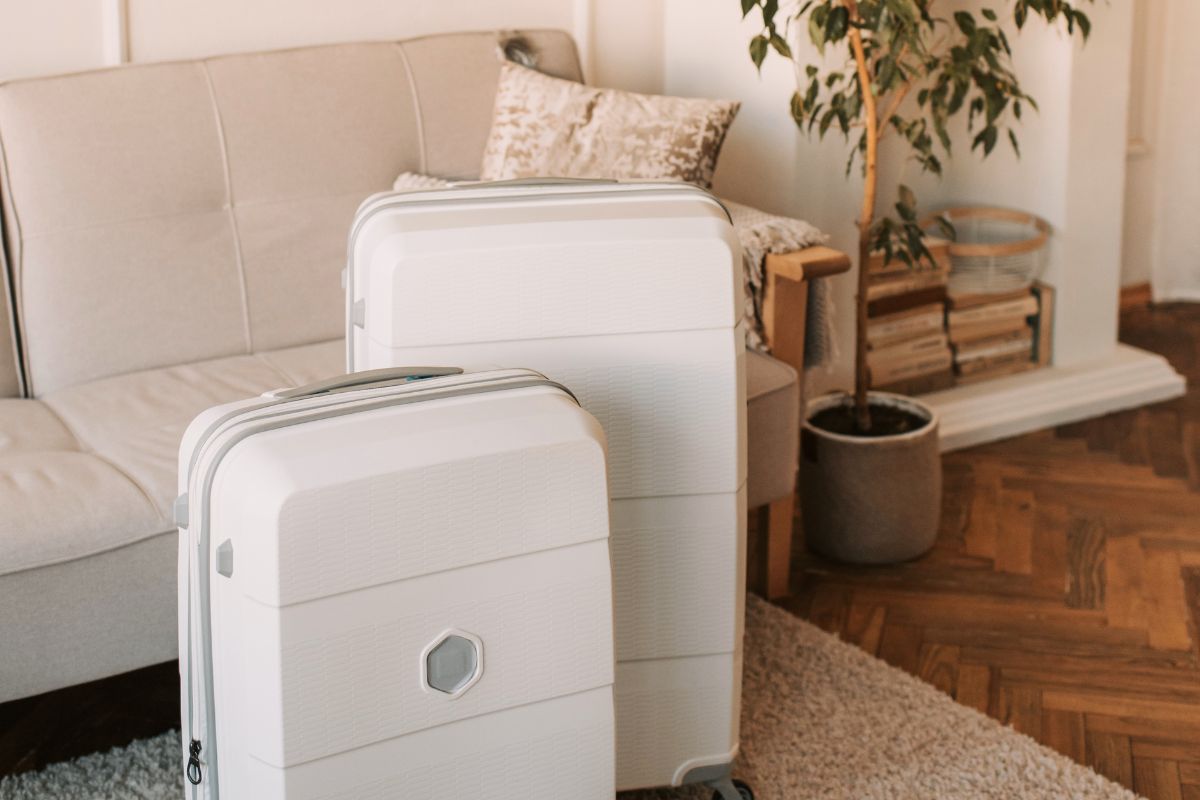Packed suitcases representing organized luggage for a travel-friendly baby packing list essentials and extras.