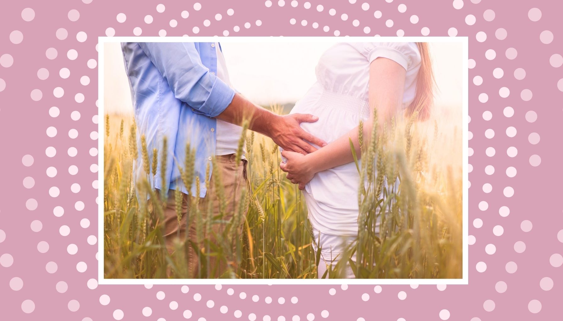 Expecting couple holding a baby bump in a field for a sweet pre-baby babymoon memory.