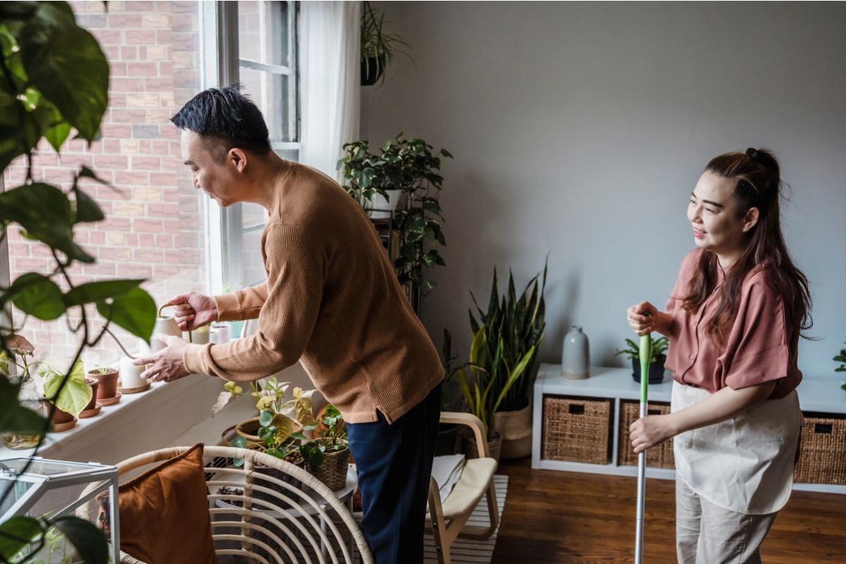 Couple doing household chores together.