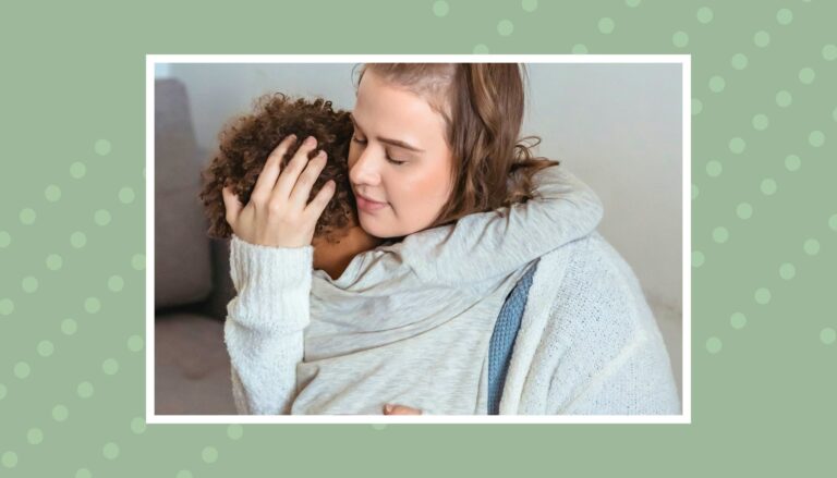 Parent hugging and comforting a toddler after a tantrum to help them feel safe and calm.